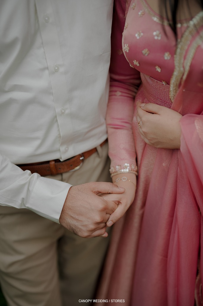 Chris and Chinnu holding hands